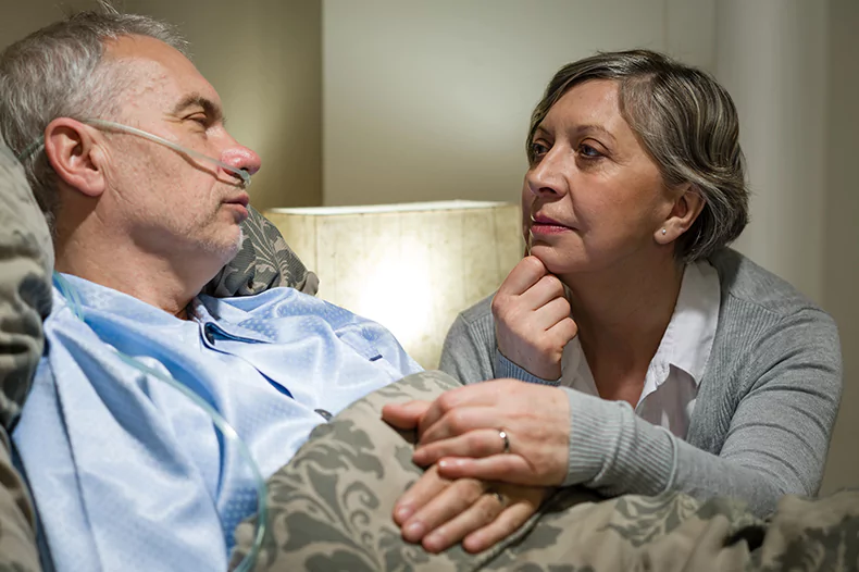 family caregiver taking care of a loved one at home.webp